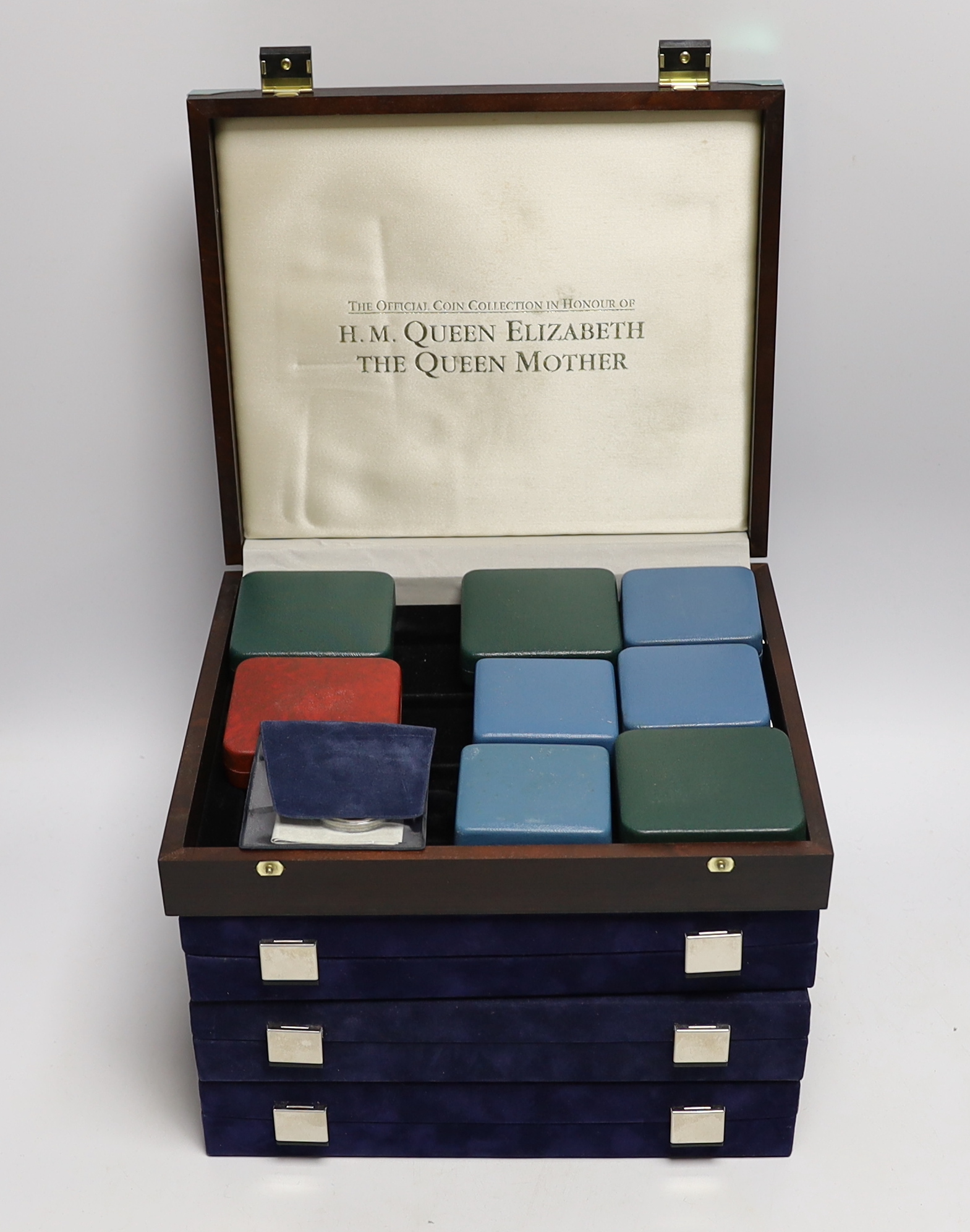 A collection of Royal Mint, Westminster mint and MDM QEII Commonwealth proof silver Royal family commemorative coins, and nine cased Royal Mint silver proof c.1992-95, in four large cases